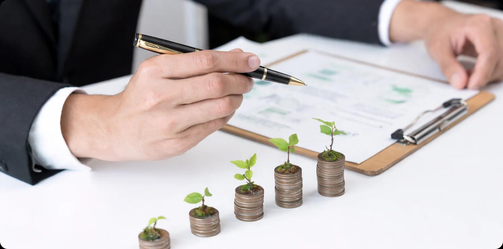 Person pointing at financial documents